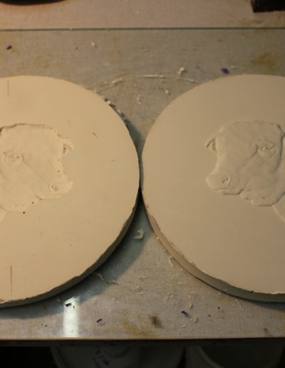 Casting the negative plaster to a positive relief plaster model.