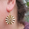 SunChild earring. A vermeil fan with the tiny face of a sunchild in the centre.